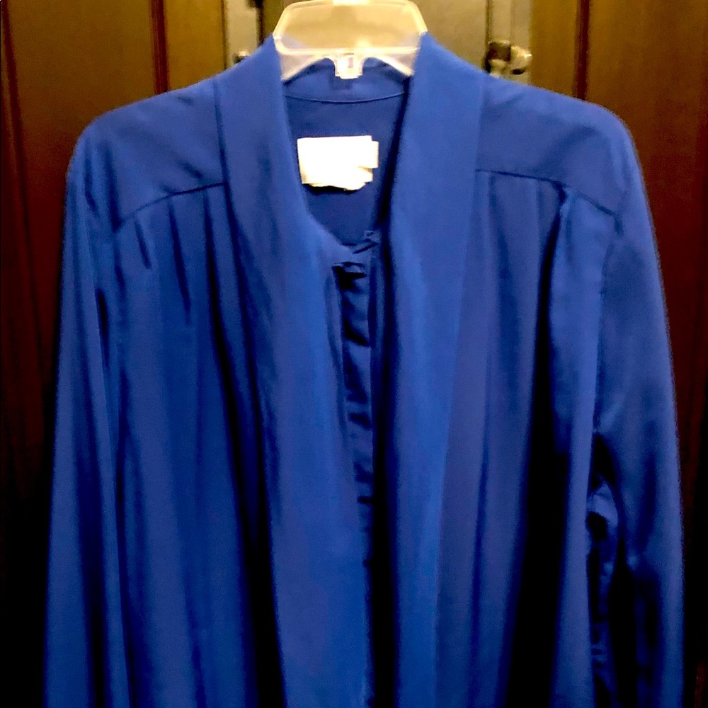 Royal blue blouse with accent tie.